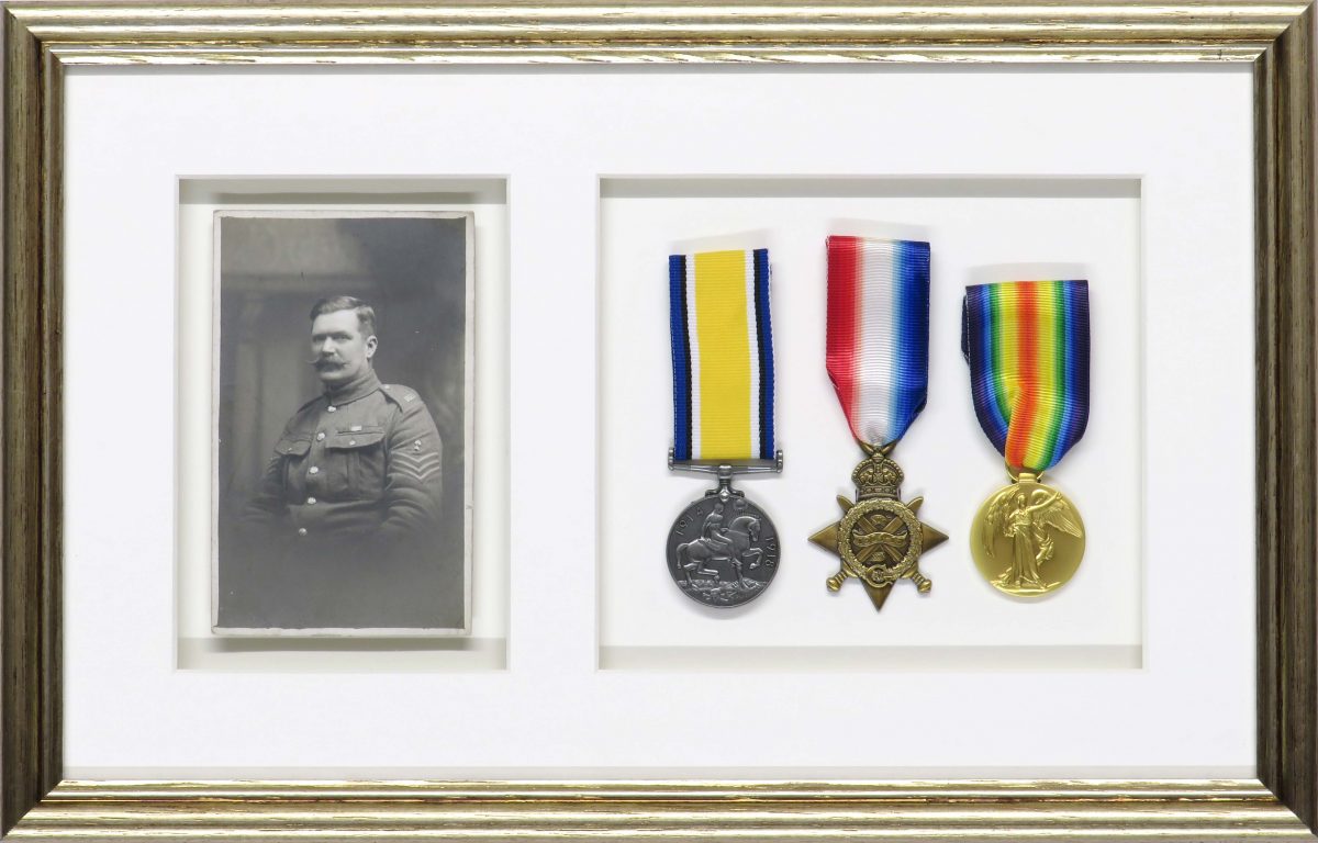 20180104115611_IMG_0022 A beautiful gold frame to house a set of medals alongside a photograph of a soldier